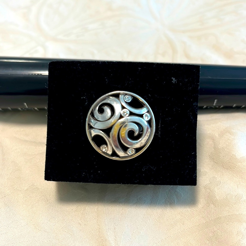 Silpada sterling silver ring with cubic zirconia. Design all around band. Size 9